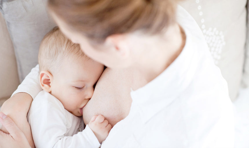 a woman breastfeeding her baby