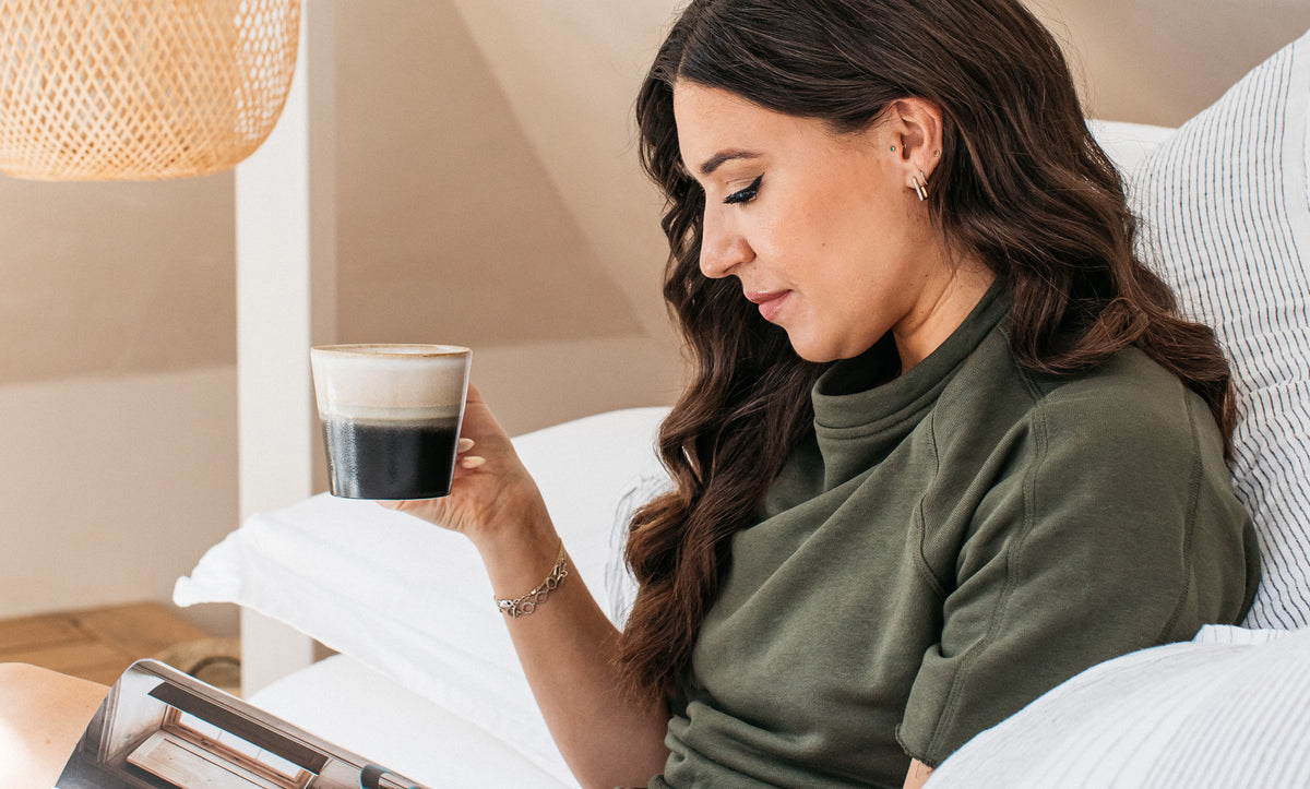 a woman with a cup of coffee