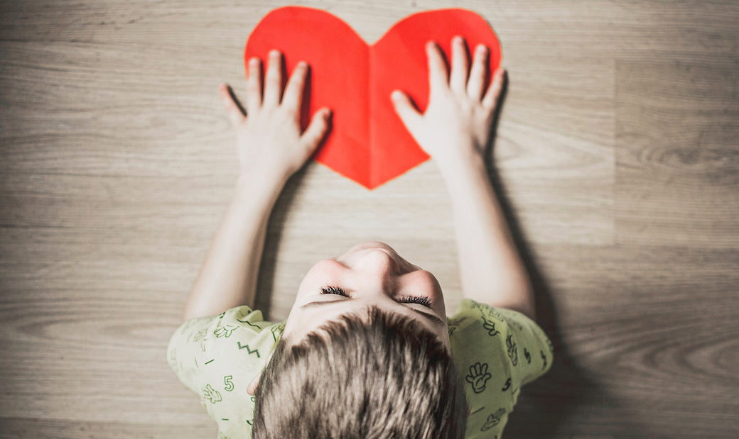 a-kid-holding-a-card-heart