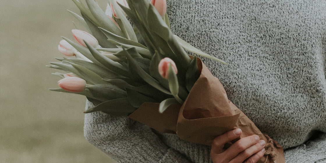 a-lady-holding-flowers