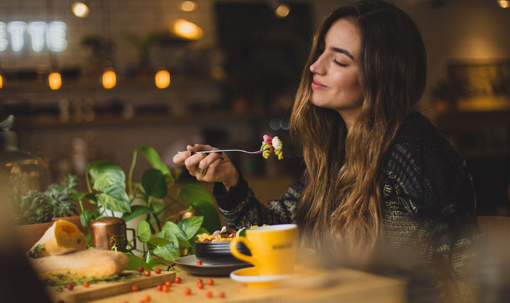 a-woman-enjoying-a-plate-of-pasta