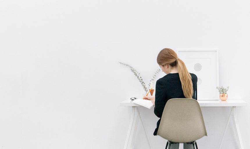 a woman working at her desk