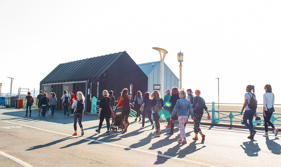 a-group-walking-along-brighton-seafront-bare-biology