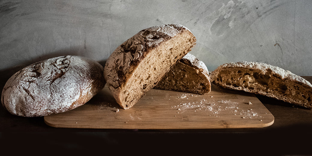 loaves of bread on a chopping board