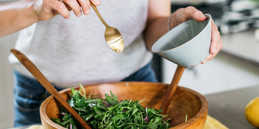 a rocket salad with salad dressing