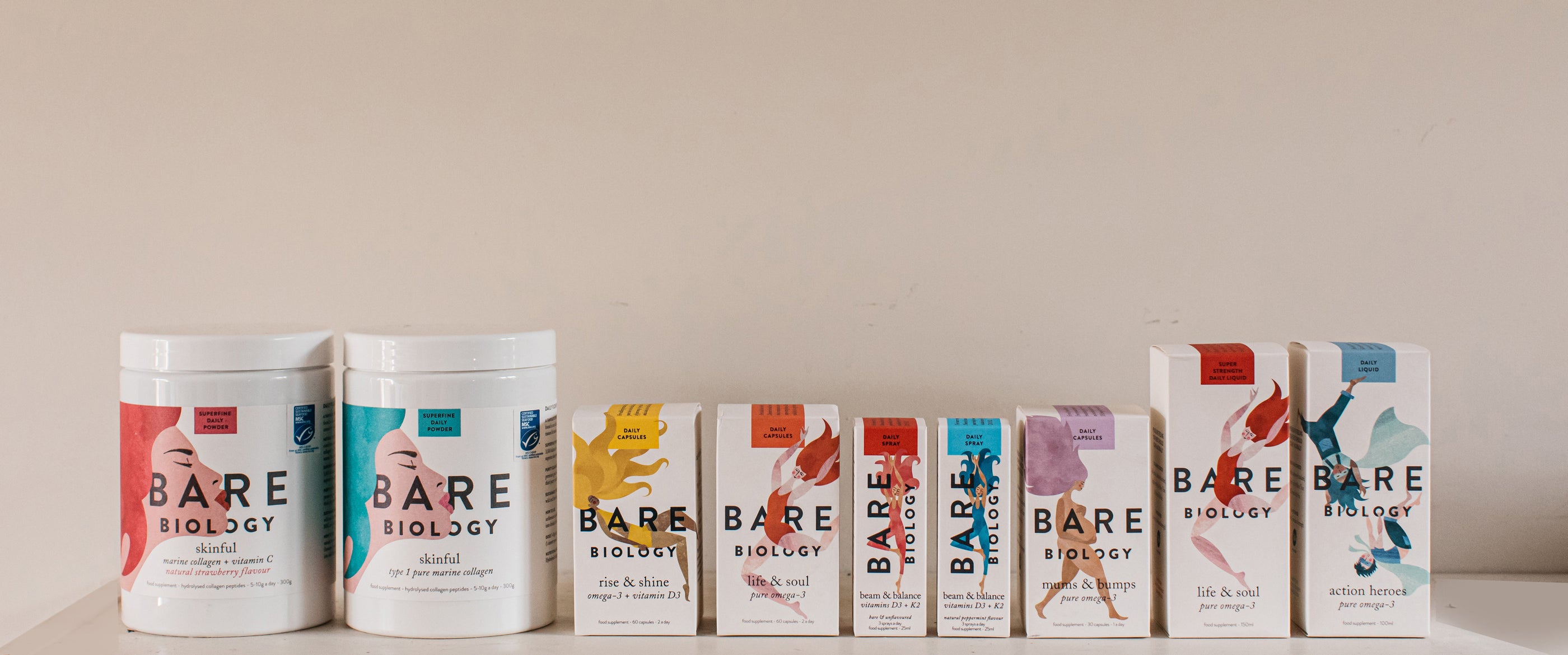 Bare Biology range lined up against a beige wall.