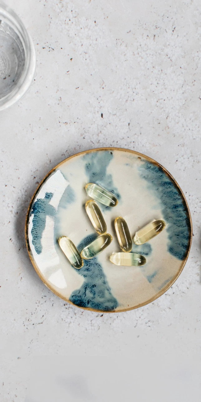 bare biology mindful omega 3 high strength capsules on a dish 