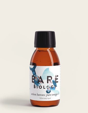 A small amber bottle with a black cap, labeled Bare Biology, contains 100ml of Pure Omega-3 Fish Oil for Kids. The label features abstract blue shapes, emphasizing its role in brain growth and offering essential omega-3 supplements including DHA.